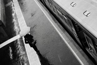 Umbrella. Train. Rain.