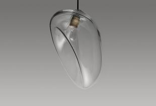 My work “The Body Series” investigates the role of typology in design and architecture. Existing typologies are decomposed, reassembled and modified based on the interacting forces of pressure and tension.  I began to investigate a pendant luminaire as a design typology. During the manufacturing process of glass blowing, its individual parts are placed in a geometrical field of tension.