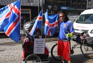 Man on the street in Reykjavik, Iceland. I was taking the sign when he asked me to photo him, so I did