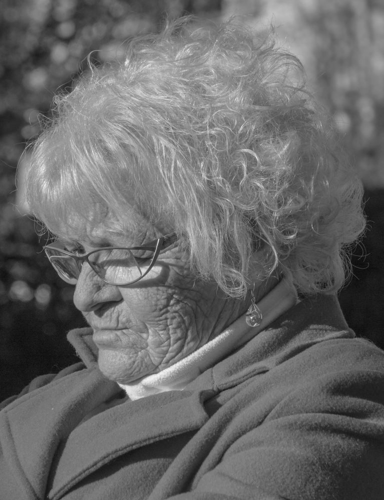 A series of black and white candid portraits of friends, family and village locals