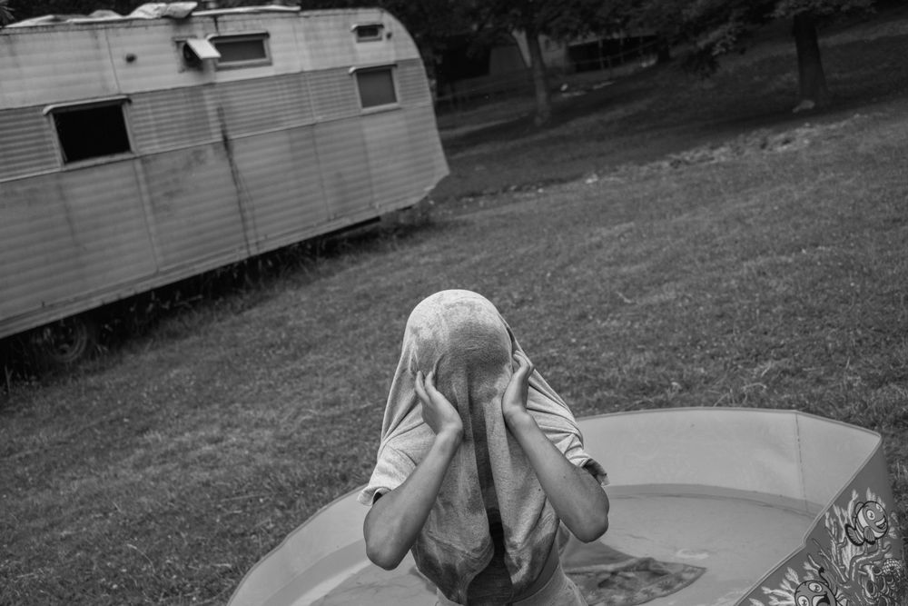 Michael, 8, plays in a kiddie pool. The first time Michael’s mother used meth she went on a five day binge. On the fifth day she woke up to find her oldest son drowning in the bathtub. The boy was resuscitated, but he and Misty’s other children were taken from her care. Michael is the only child who remained in her custody.