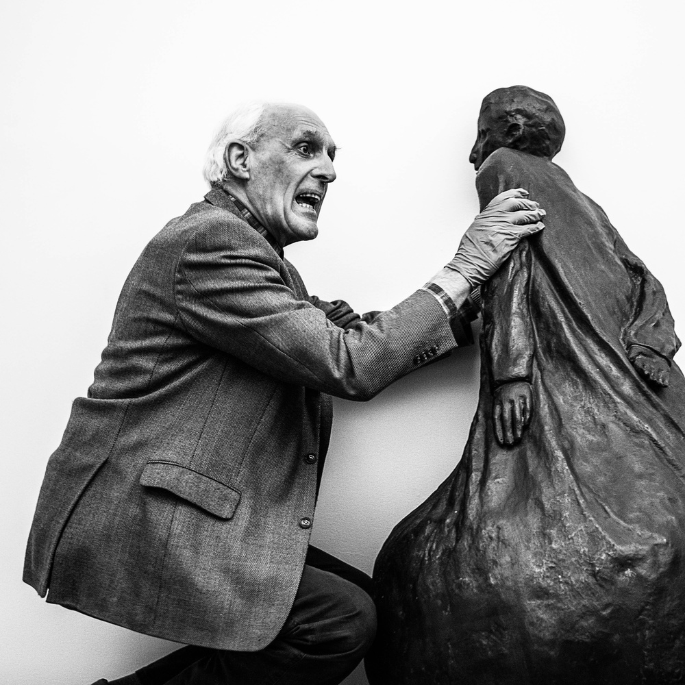 Blind or partially sighted people visit museum.