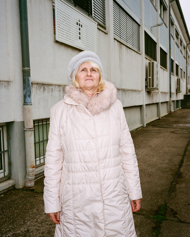 Olga. On the outskirts of Frankfurt, an industrial area transforms every Sunday as diverse faith communities find solace in affordable, quiet spaces. Hidden within plain warehouses, independent churches and cultural associations thrive, hosting prayers, weddings, and gatherings. Surrounded by office buildings, repair shops and one of Germany's largest meat producing factories, these small communities remain unnoticed by much of the city. In contrast to prominent institutionalized churches, they quietly foster connection and tradition among themselves. © Josefine Rauch