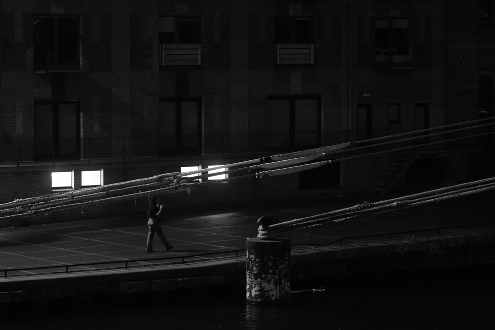 Lonely in the dark city. In the shadows of Amsterdam. 