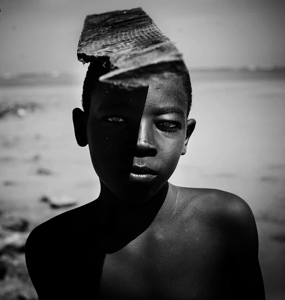 Shadow Child. A child working in the boat industry. The photo was taken in Sudan, Port Sudan © Hozifa Mahmmed