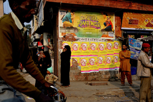Information and Communication Posters for Polio vaccination awareness at a market place wall in Moradabad, Uttar Pradesh