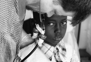 Many years ago Dr. Keith, our pediatrician, attached these miniature Canadian Inuit mukluks to his stethoscope to distract frightened young patients.  This distraction failed to work with this young boy, terrified by his first visit to a physician.                                              © Lola Reid Allin