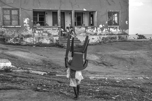 Carrying His Chair to School, Kikomvo, Angola