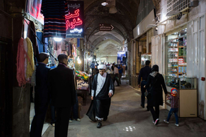 A mullah walks through the bazaar of Isfahan.