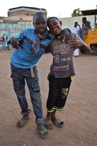 Children play around the stadium