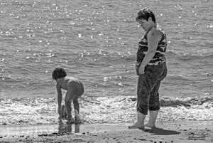Mother watching by the seaside, Clacton-on-Sea