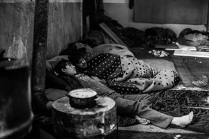 15 years old Shaw Khan from Afghanistan ( at the front) with his friend in abandoned warehouse in Belgrade, Serbia.