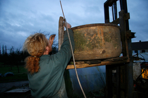 Piping the apple juice into a barrel using gravity