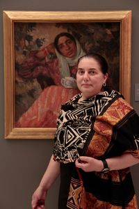 Artist and Professor Roxana Trestioreanu in front of the painting by Cecilia Cuțescu Storck, © National Museum of Art, Bucharest