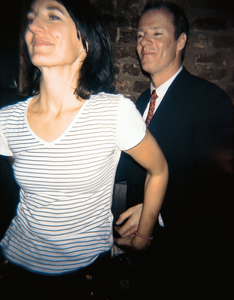 Woman with striped shirt and man with suit