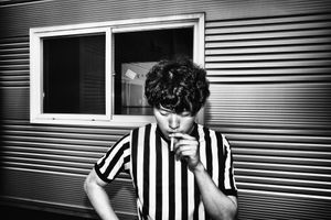 Referee Kim Gi-min has a cigarette before officiating.