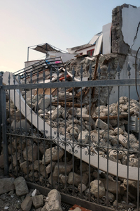 The totally collapsed house where Ciro and his two little brothers were rescued.