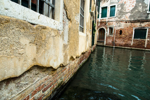 Damage to the facades of buildings in the city of Venice is caused by continuous wave action from boats and from natural causes, especially strong scirocco and bora winds, storms and of course frequent high tides.