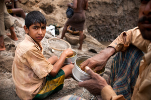 An under aged labor during his lunch break