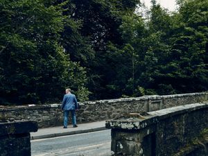 Hesitating man an a bridge, Aberfeldy