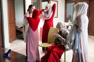 Actress Zaskia Mecca, owner of fashion brand Meccanism, with actresses Natasha Ritzkin and Tika Bravani, gets ready for a cover photo shoot to promote the new movie ''Hijab''.