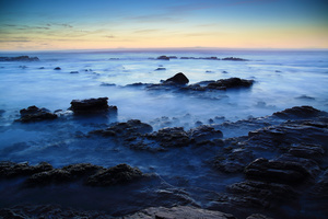 Fragments / This is a double exposure that I shot on one of my favorite beaches on the Cape Peninsula, not far from Cape Town.During the day this beach is often crowded with surfers, but at twilight it turns into a magical spot, with its cracks and scars, and something of a fairy place.