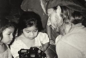 Italian photographer, Timo, shows the girls living at the DIF center some of the shots he took.