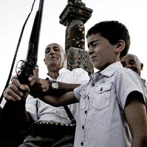 Introduction to life in Barbagia. A child shoots for the first time.