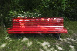 Three red benches in Volkspark Hasenheide, Berlin, 2011