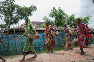 Women going back to their home after a day long work in Shyamnagar, Satkhira, Bangladesh
