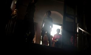 Sittwe, Myanmar, 2012. Orphaned children group together in one of the cities monasteries. They were left by their families as they fled their burning homes. © Spike Johnson