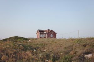 A red abandoned house in Peniche, Portugal, June 2018