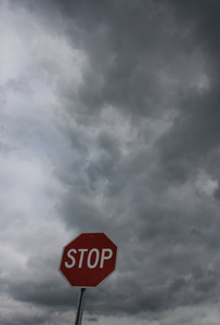 STOP sign under stormy skies