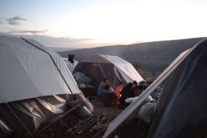 Local people gathered around fire while chatting about the damage of earthquake