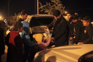 Benefactors while distributing toys to kids