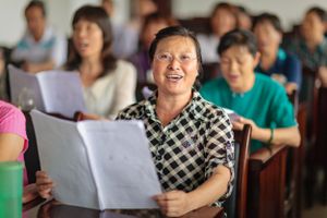 A woman singing during a rehearsal at a University of the Third Age (U3A). Older citizens can take advantage of any one of dozens of different classes.