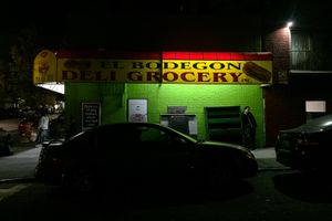 Man standing at Bronx Grocery store.