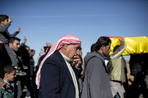 A Kurdish man reacts during a funeral of a People's Protection Units (YPG) fighter killed during fighting with Islamic State forces in the Syrian town of Kobane, during a funeral in Suruc, near the Turkey-Syria border, November 6, 2014.