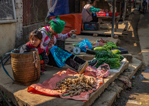 Woman and daughter selling food in Lao Cai.
