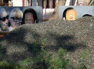 Gravel pile and politicians, north of Thanjavur, Tamil Nadu, 2010.