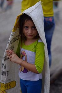 A child protecting herself from the rain, Palomino