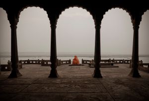 Varanasi, India: A pilgrim man is meditating in a deserted palace. © Matjaz Krivic