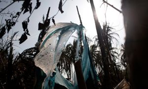 Sittwe, Myanmar, 2012. Fire ravaged homes. Now the military use this burnt village as an outpost to contain the minority Rohingya population. © Spike Johnson