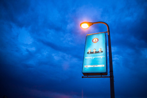 A poster of the ruling Cambodian People’s Party (CPP) can be seen lit by a lamp post at the Japanese bridge in Phnom Penh.