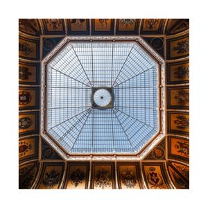 The skylight  framed by old paintings