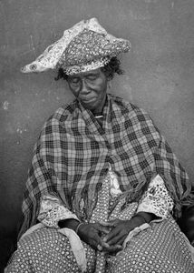A Namibian Herero woman wearing  the traditional Victorian-style dress adopted during the colonial era. The horned feature of the headscarf symbolises the Herero’s prized cattle, which are a wealth and status symbol in their communities.