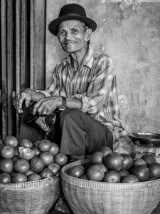 Seller of jeruk (oranges) at the local market in Kepanjen.