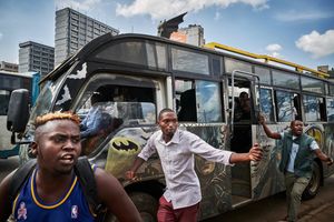 Makangas of a Matatu, which is dedicated to the superhero Batman, advertise passengers in the roundabout of the Railway Bus Station. The main task of the Makangas, apart from collecting money, is to recruit passengers. The job is tough. The Makangas work long hours running around and don‘t sleep much.