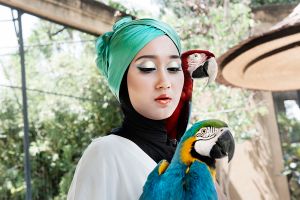 Dian Pelangi poses during a photo shoot at the Bird Park in Bali.