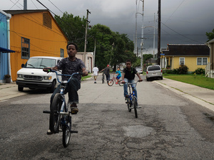 USA. New Orleans. 2015.Kids playing with bicycles.